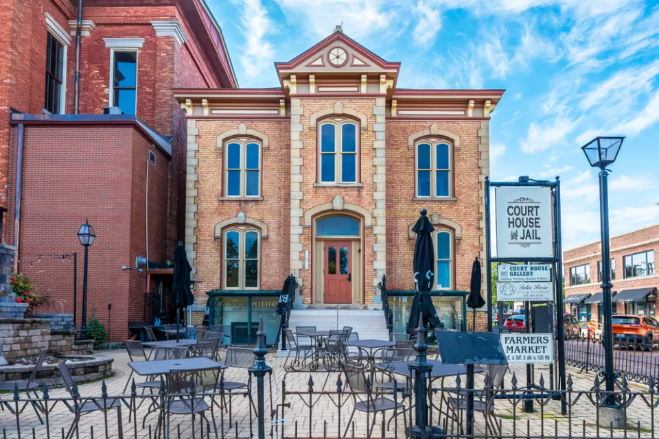 A street view showing the historic courthouse and jail in Woodstock, Illinois.